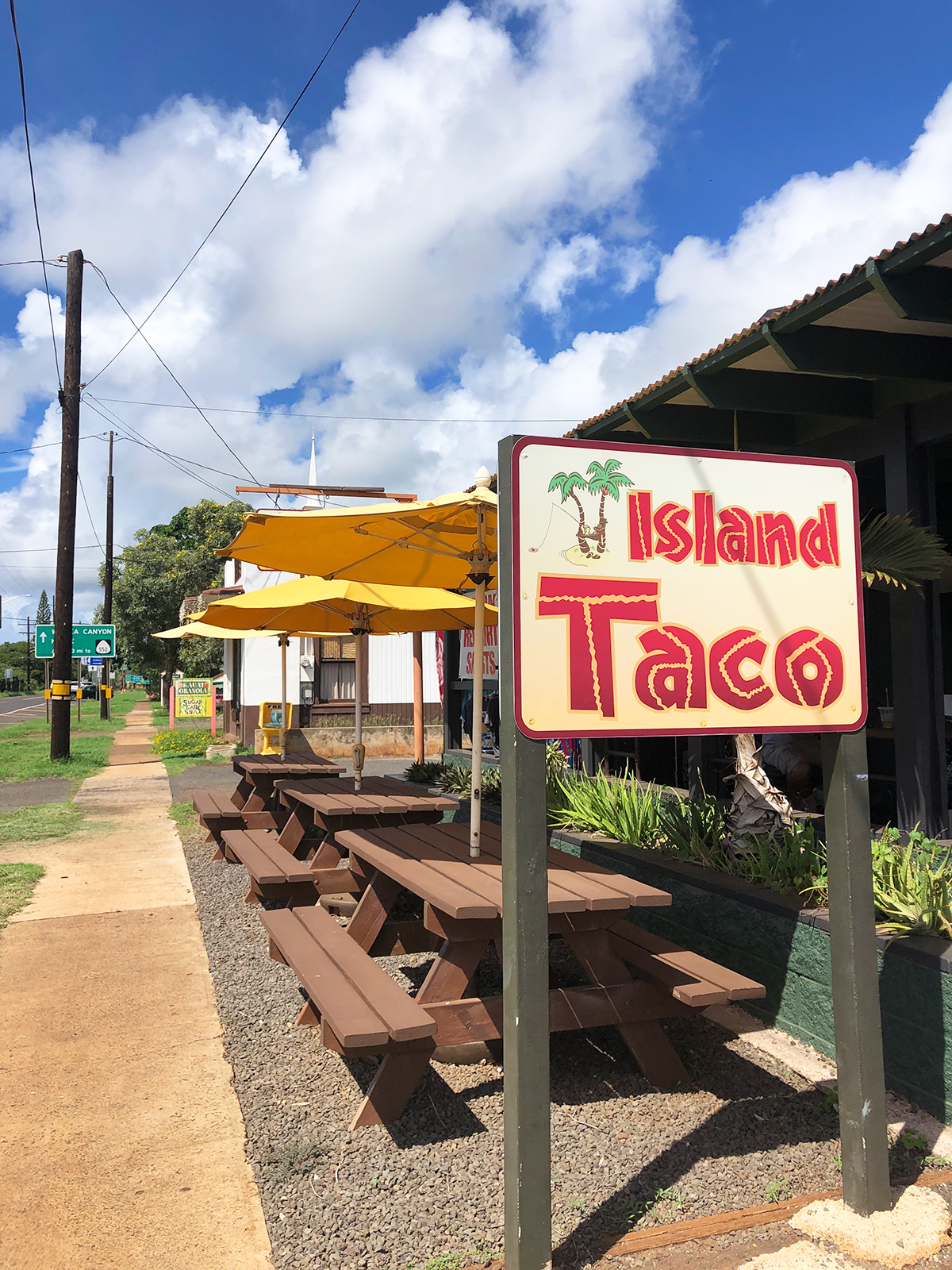 best restaurants in kauai island taco Waimea sign with picnic tables