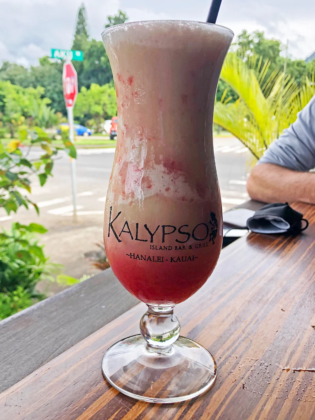 fruity drink in tall glass that says calypso island bar and grill Hanalei kauai