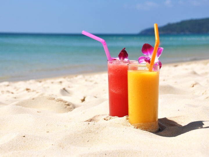 best places to eat in kauai view of drinks on the beach with Hawaiian flowers