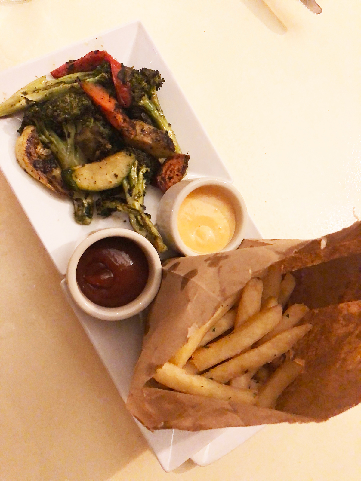roasted veggies two sauces and truffle fries in a bag