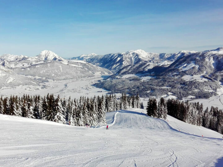 Best countries to visit in January view of ski slopes and snowy mountains