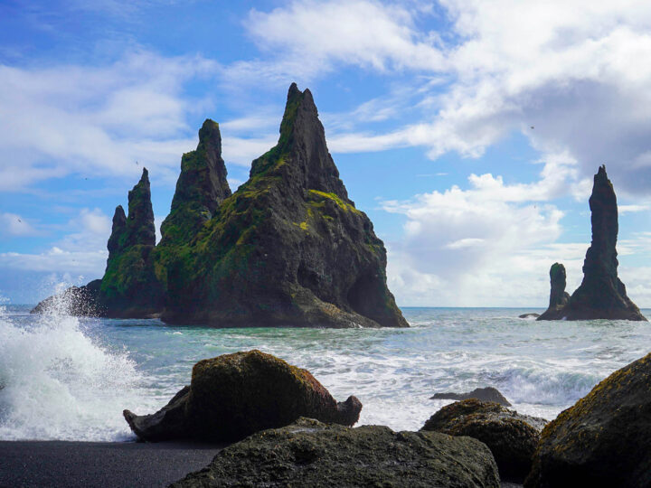 rocky shore of Iceland ocean on sunny day best countries to visit in January