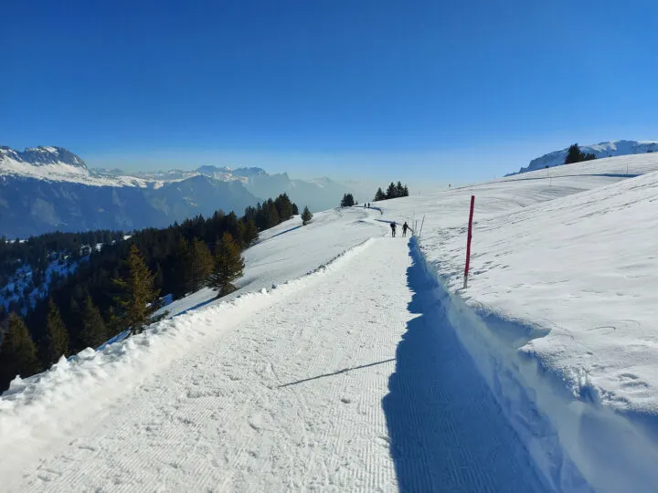 best places to visit in January Europe view of Switzerland snow with mountains in distance