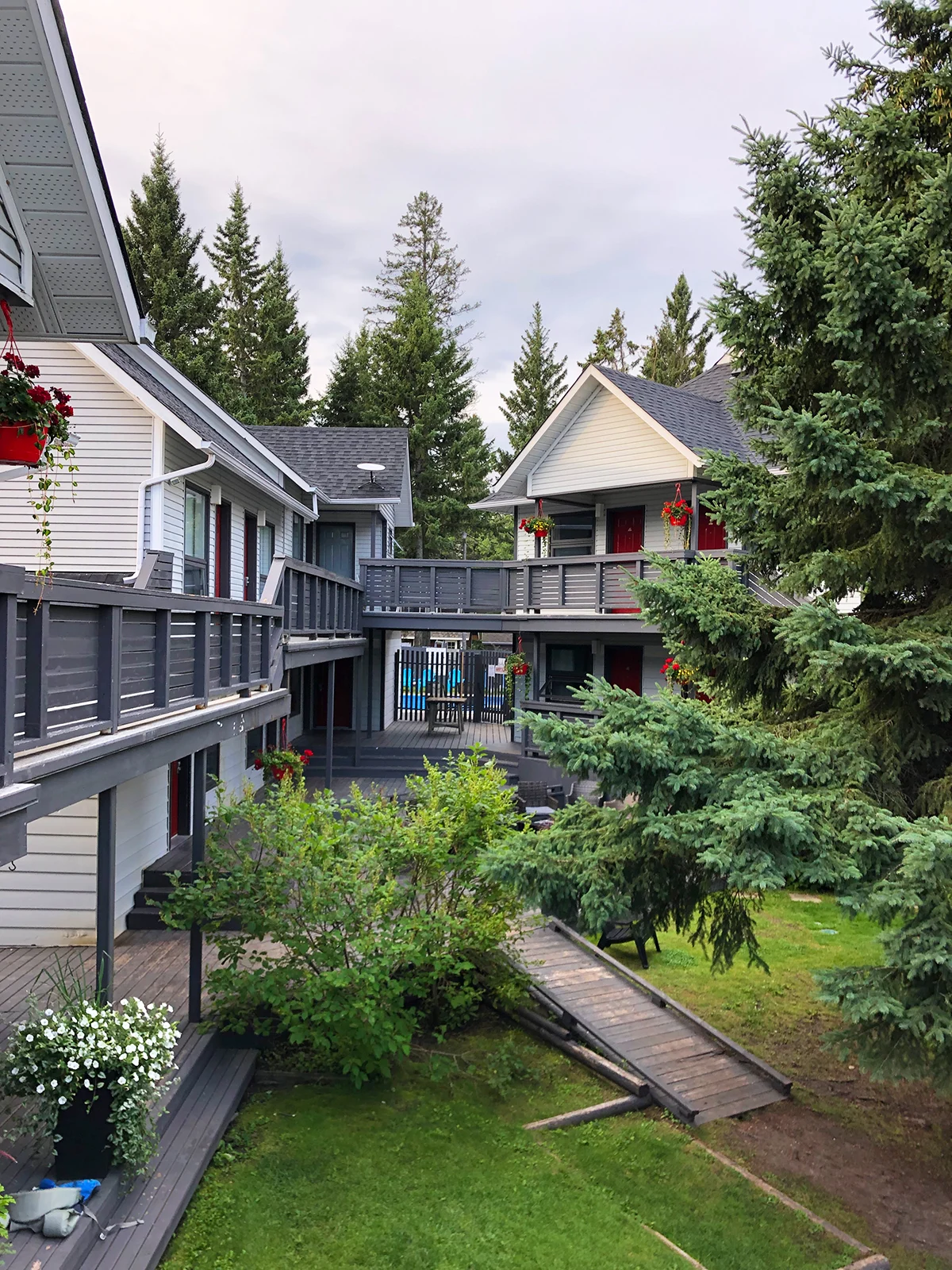 where to stay in Clear Lake Manitoba view of cottages trees and decking