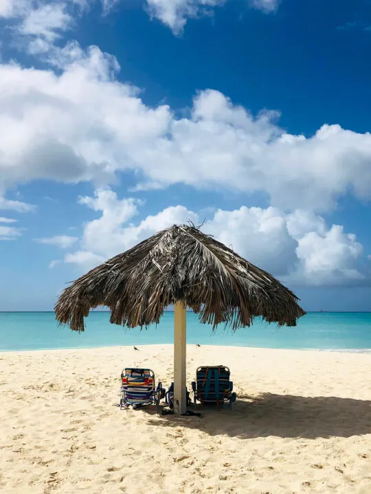 vacation in January view of palapa with chairs and beach in distance