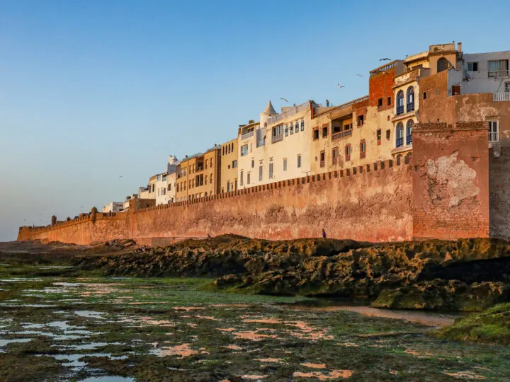 Morocco best countries to visit in January view of buildings with green mossy water in foreground