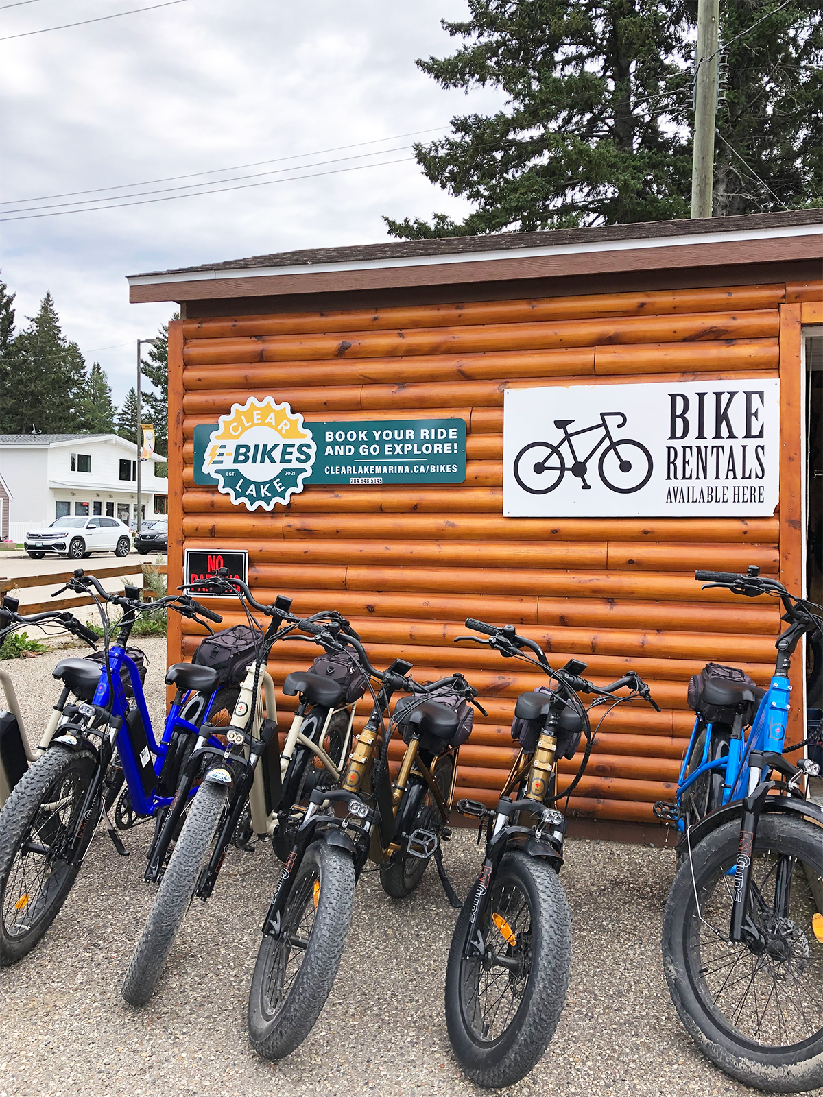ebikes clear lake manitoba view of bikes and wooden building with sign