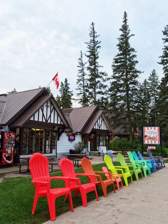 boardwalk restaurant with colorful chairs out front