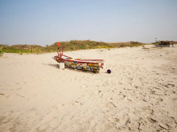 small boat on sandy beach in The Gambia