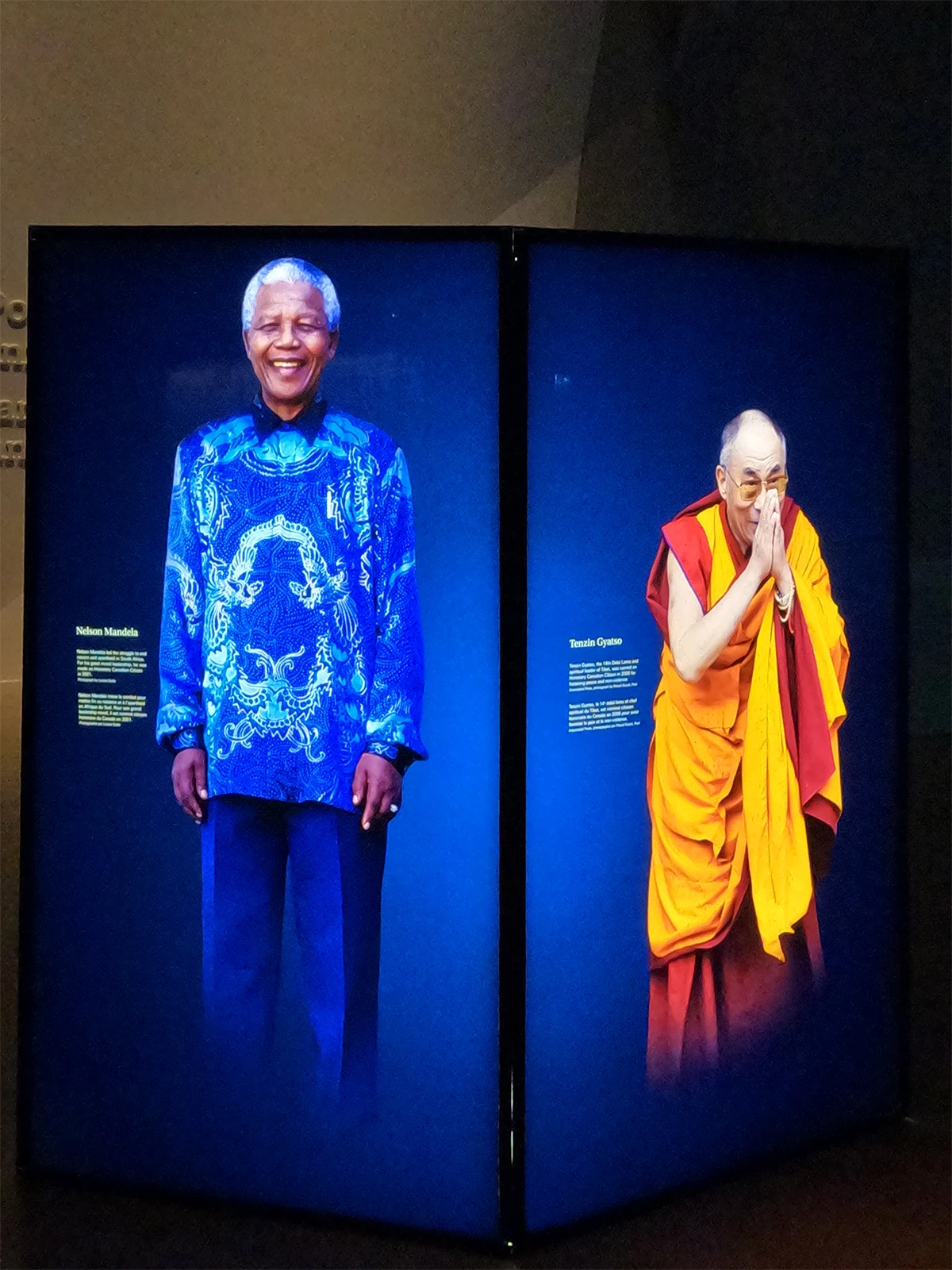 electric screens at Canadian Museum for Human rights with photos of Nelson Mandela and Tenzin Gyatso