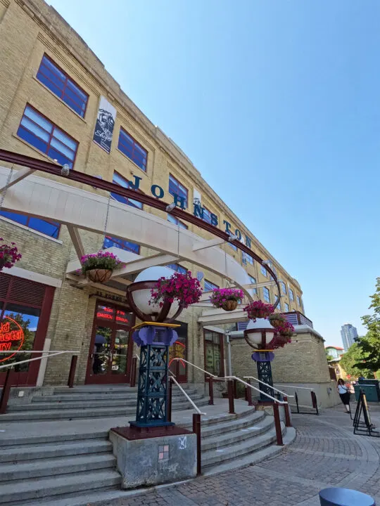 best things to do in Winnipeg visit Johnston station view of building front with flowers steps and brick