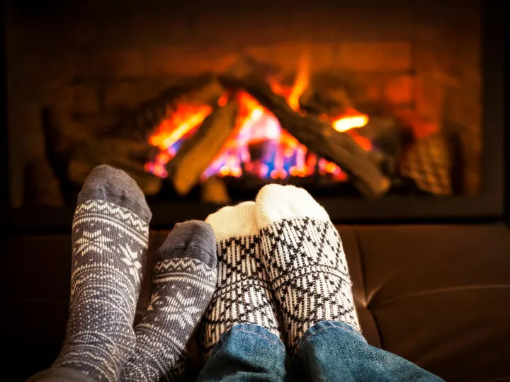 Monteverde activities view of cozy fireplace with two sets of socks in front