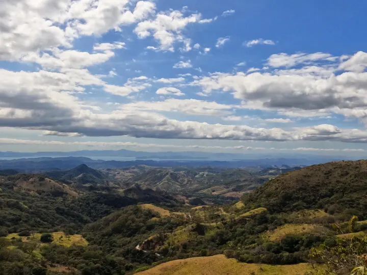 views while driving San Jose to Monteverde tree covered hills looking out to mountains