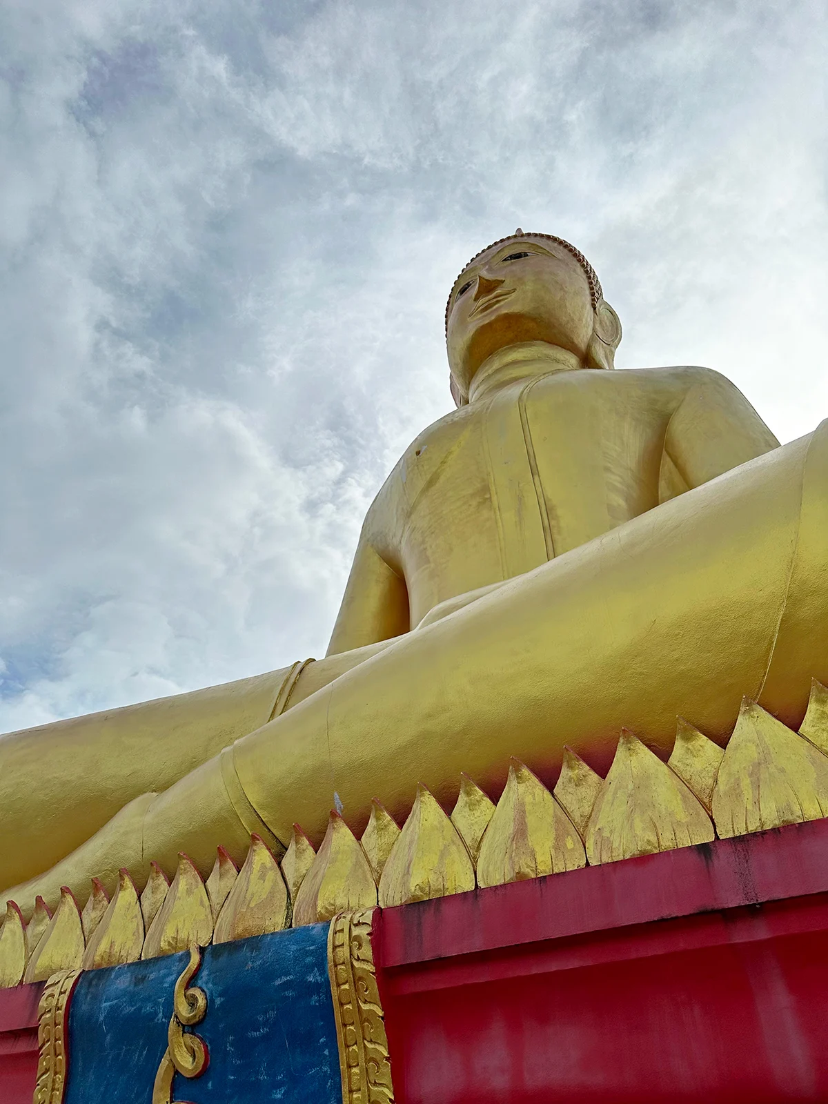 Big Buddha Phang Nga looking up at golden painted large buddha up to sky