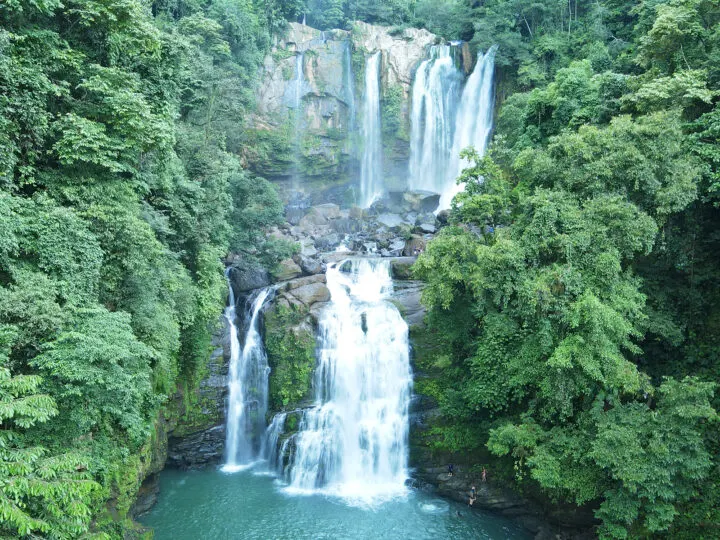 double tier Nauyaca waterfall surrounded by trees