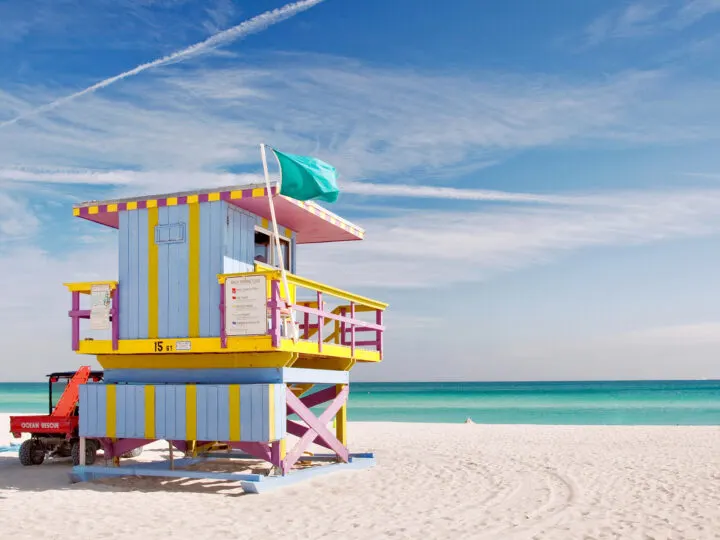 miami florida beach multicolored life guard shack teal water white sand winter getaways in usa