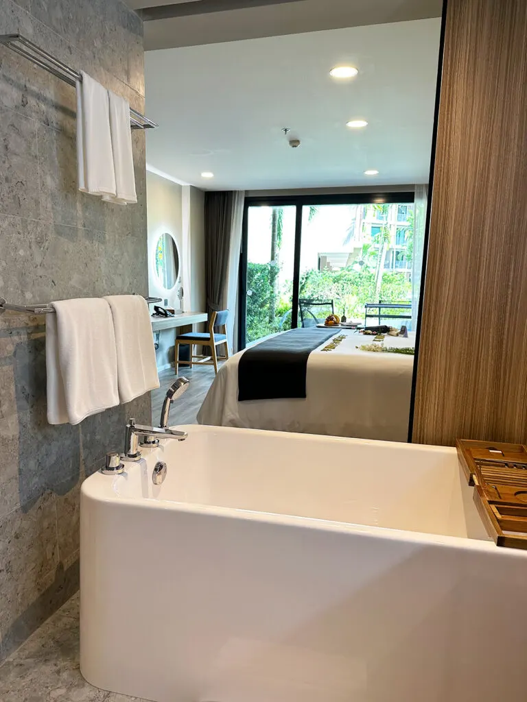 khao lak hotel view of bathtub and hotel bed