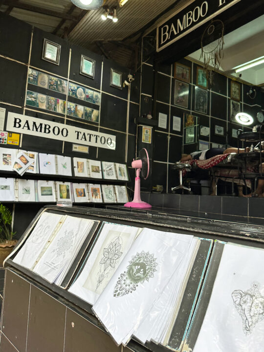 tattoo shop with samples on black tile