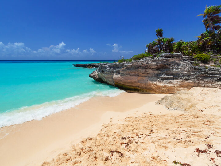 beaches in Mexico with tan sand turquoise water and rocky shoreline