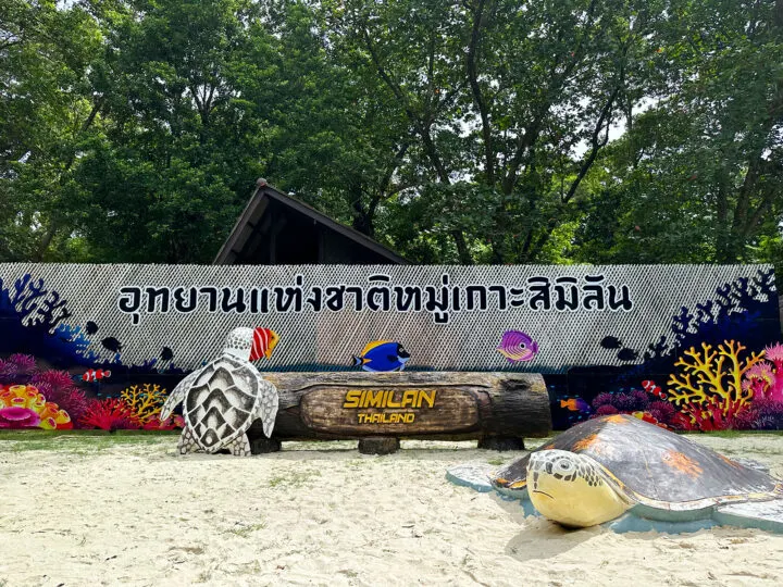 similan islands national park sign with sea turtles and thai language