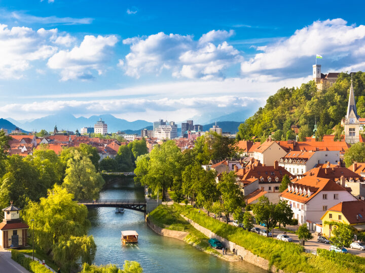 Ljubljana Slovenia in Europe view of town with river and mountains in distance