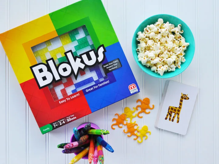 cheap winter activities view of blokus game with young toys crayons and popcorn