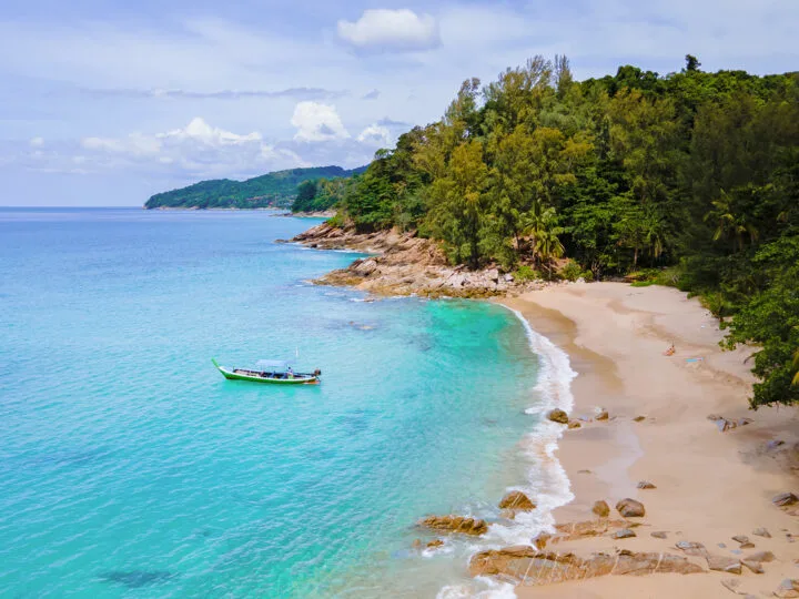 banana beach phuket on coral island view of tan beach azure water lush coast from above