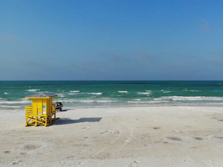 beaches on the gulf coast view of yellow lifeguard shack white sand teal water blue sky