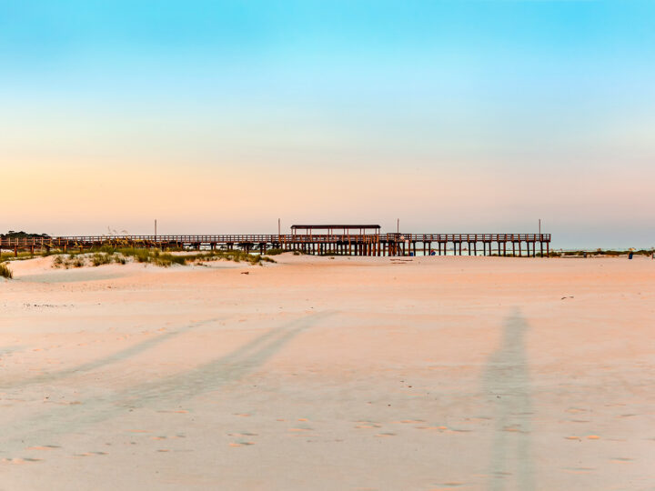 dauphin island alabama view of pier and beach at sunset