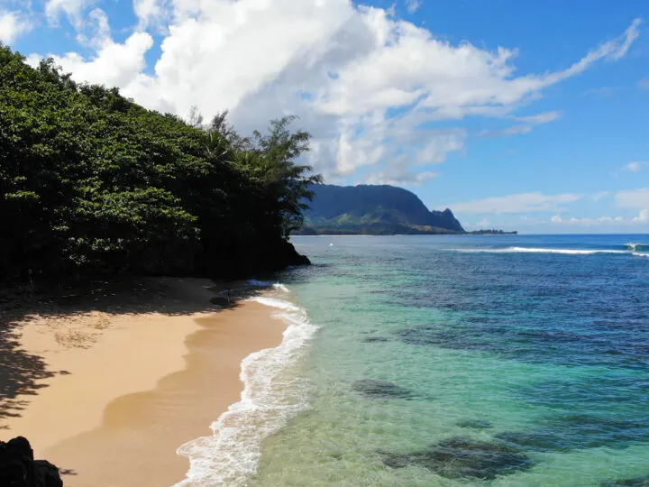 maui vs kauai view of beach tan sand teal water with coast