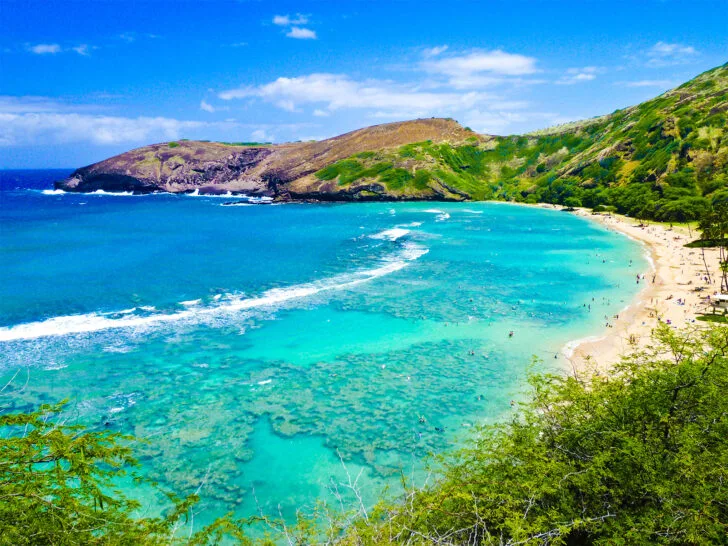 Hanauma Bay Oahu view of cove with teal water beach and hillside Hawaii packing list