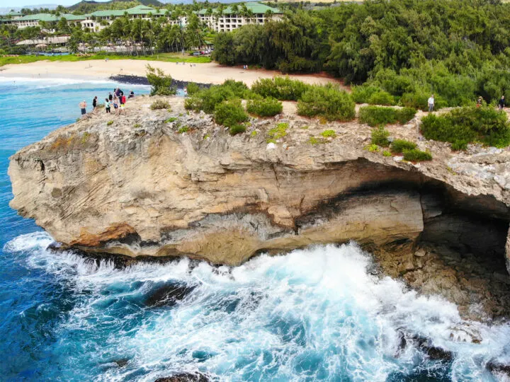 kauai vs maui for families giant rock with water and white waves