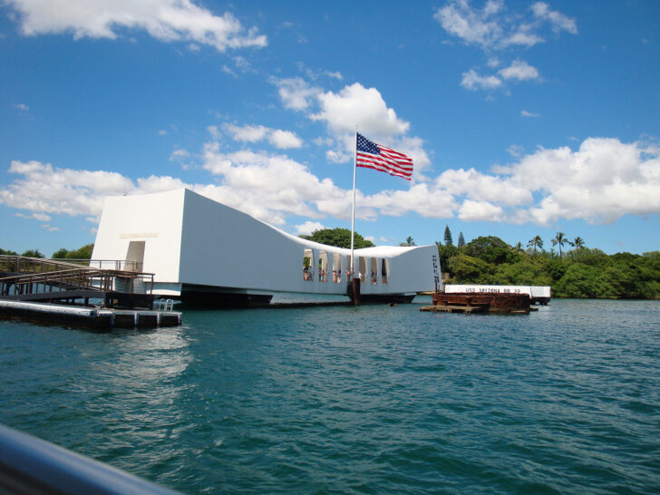 Pearl Harbor memorial Oahu view of white building with American flag over water