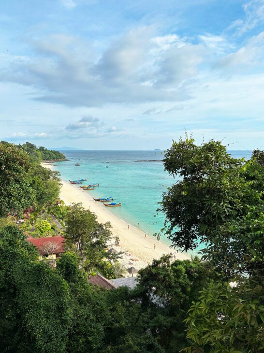 view of beach through trees at accommodations on phi phi islands