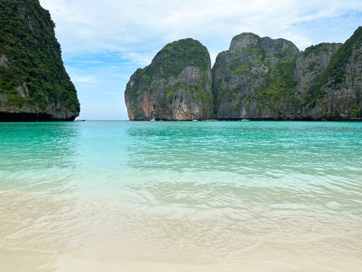 Maya bay phi phi islands thailand view of beach with teal sand and land across the bay