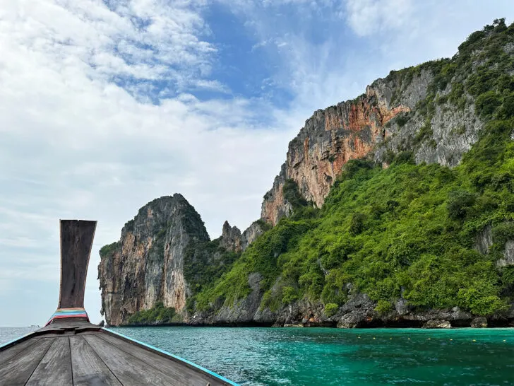 front of long tail boat and hillside going to Maya Bay Phi Phi Island