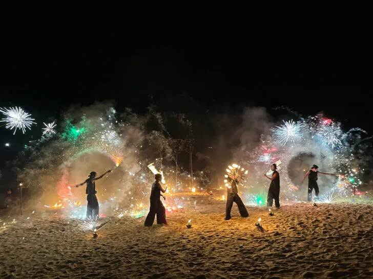 five men throwing fire on beach in thailand koh phi phi