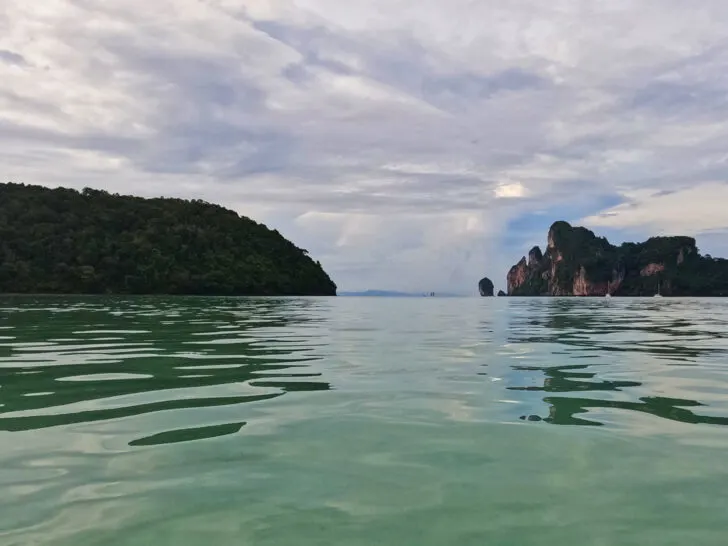 what to do in phi phi islands view of green water and hills in distance on cloudy day