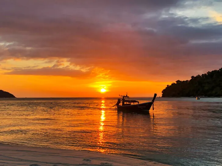 thailand best beaches view of orange sunset with boat at Koh Adang