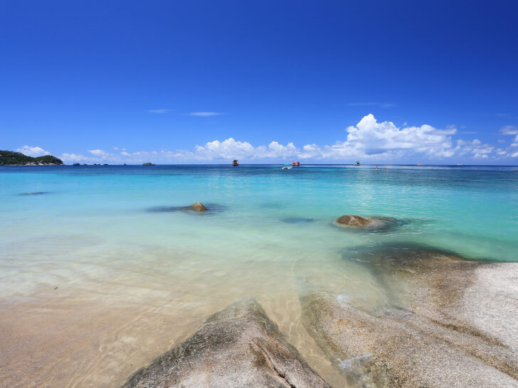 blue sky blue water with sandy shoreline