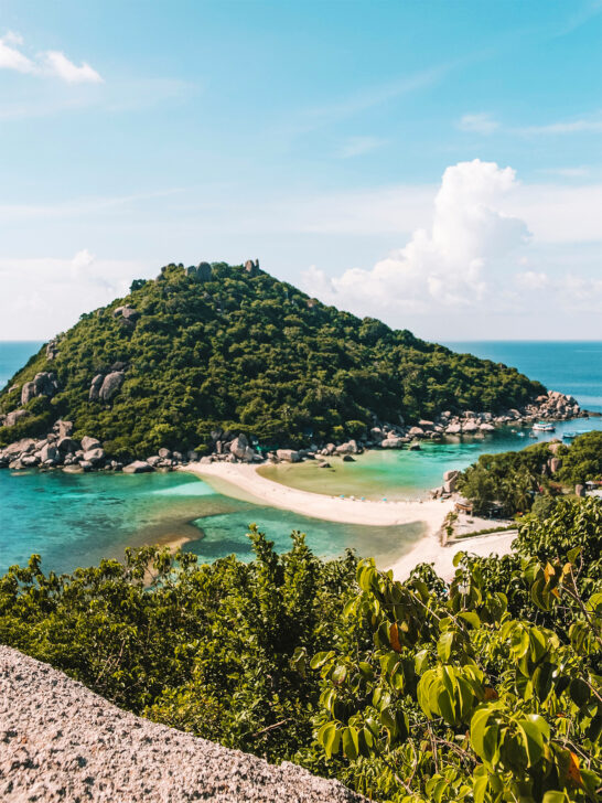 famous thailand beaches small beach between two karsts with teal water and lush vegetation