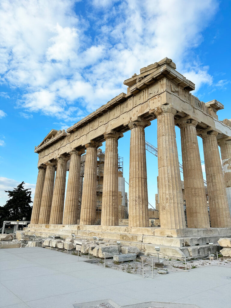 Greek islands cruise stop in Athens view of Parthenon tall pillars of stone against blue sky