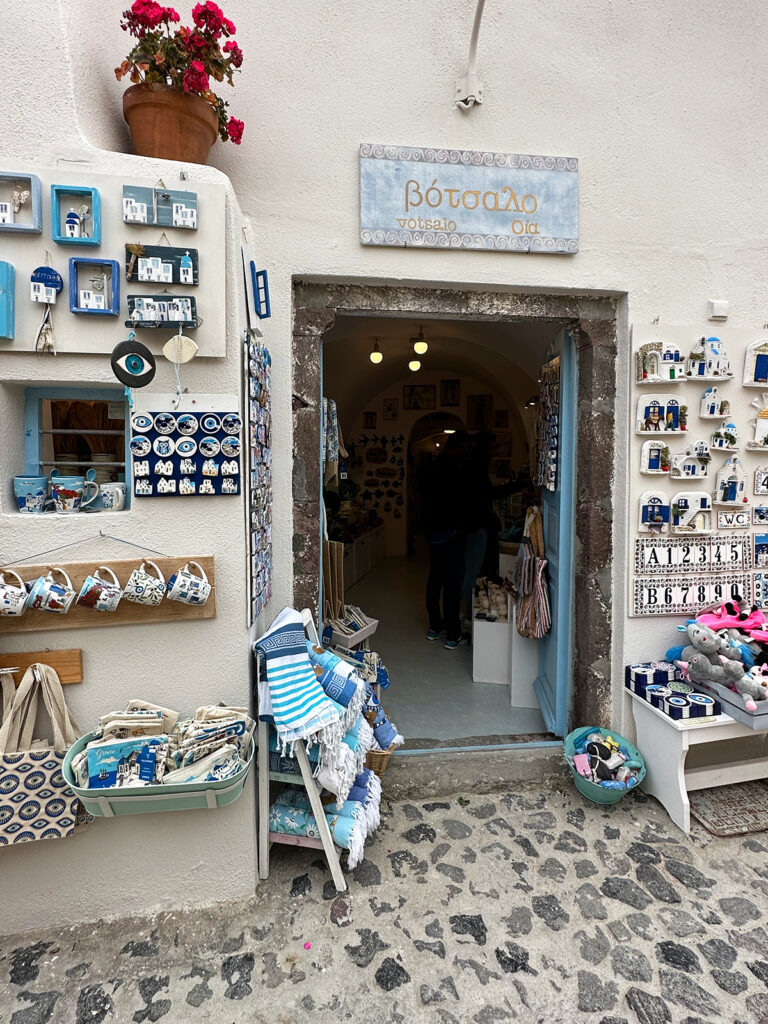 cursing Aegean Sea view of shop entrance with greek souvenirs