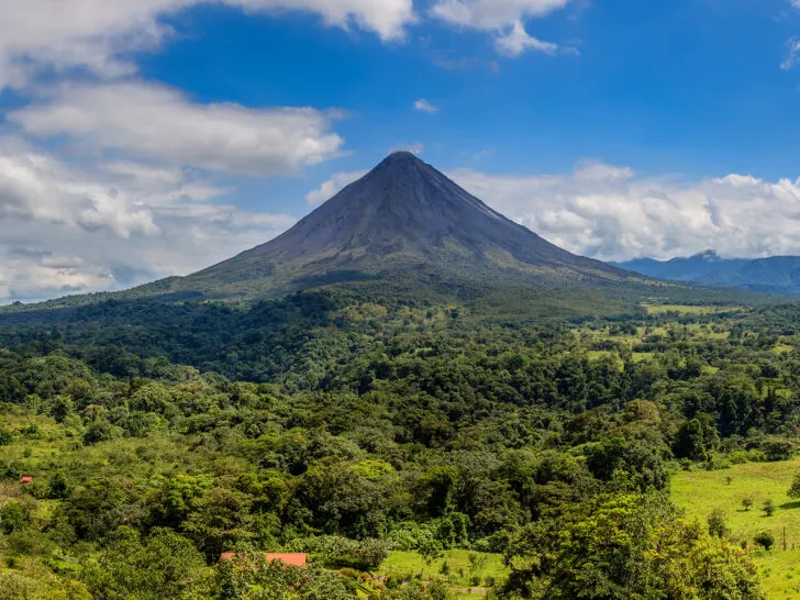 arenal volcano view of large volcano peak on a clear day with dense forest