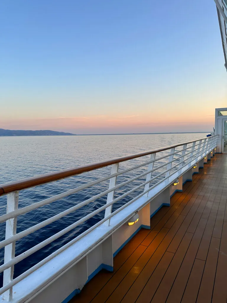 Celestyal Cruises Review watching the sunset at dusk from the railing