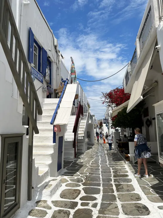 streets with stone and white plus white buildings in narrow alleyway