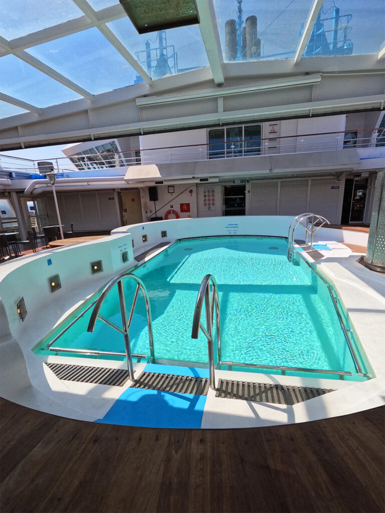 pool on ship deck with windows above