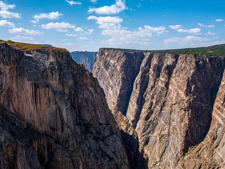 Colorado road trip view of black canyon of the gunnison with flat top deep canyon with black sides