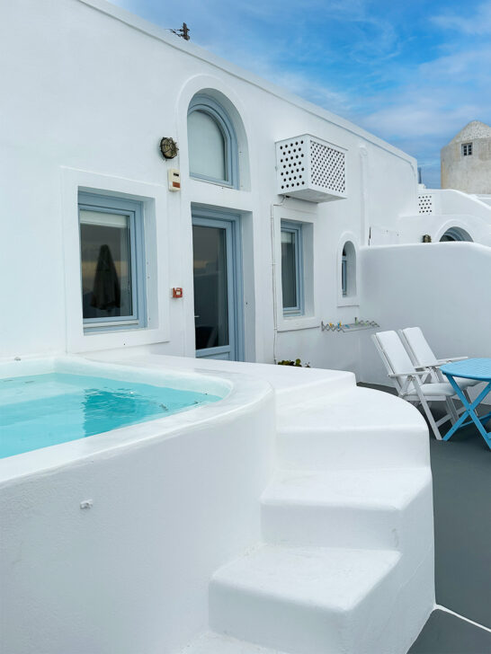 Romance in Santorini vs. Mykonos view of private villa with steps leading to pool
