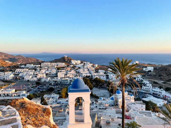 greek village with white and blue buildings nearing sunset best place in Greece for couples